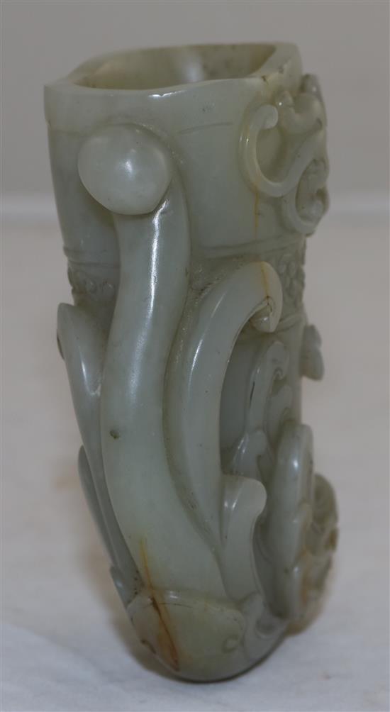 A Chinese archaistic pale celadon jade phoenix rhyton, height 10.2cm